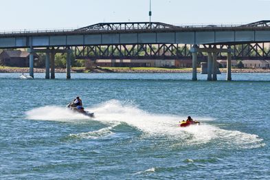 People tubing behind a jetski in Pierre
