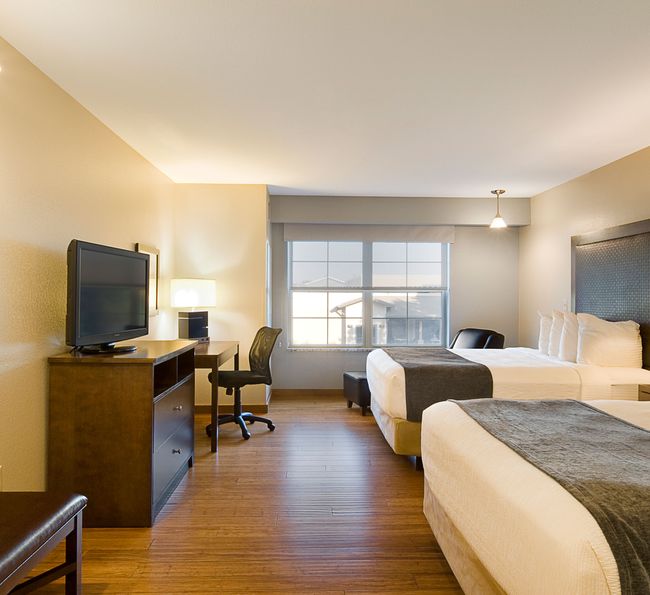 Double queen room with wood floors